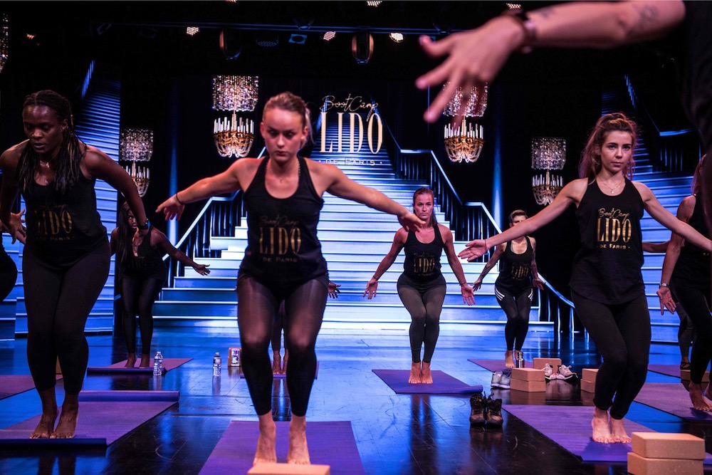Participants perform during a 'bootcamp' workshop conducted by Lido dancer Victoria on the stage of the Lido cabaret in Paris September 10, 2019. — AFP pic
