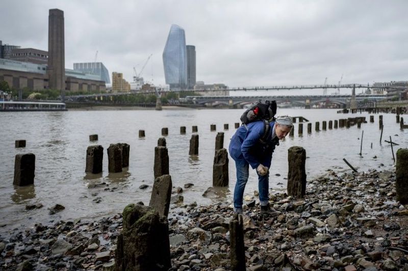 'Mudlarks' like Lara Maiklem scour the shores of the River Thames in London for historical items. u00e2u20acu201d AFP pic