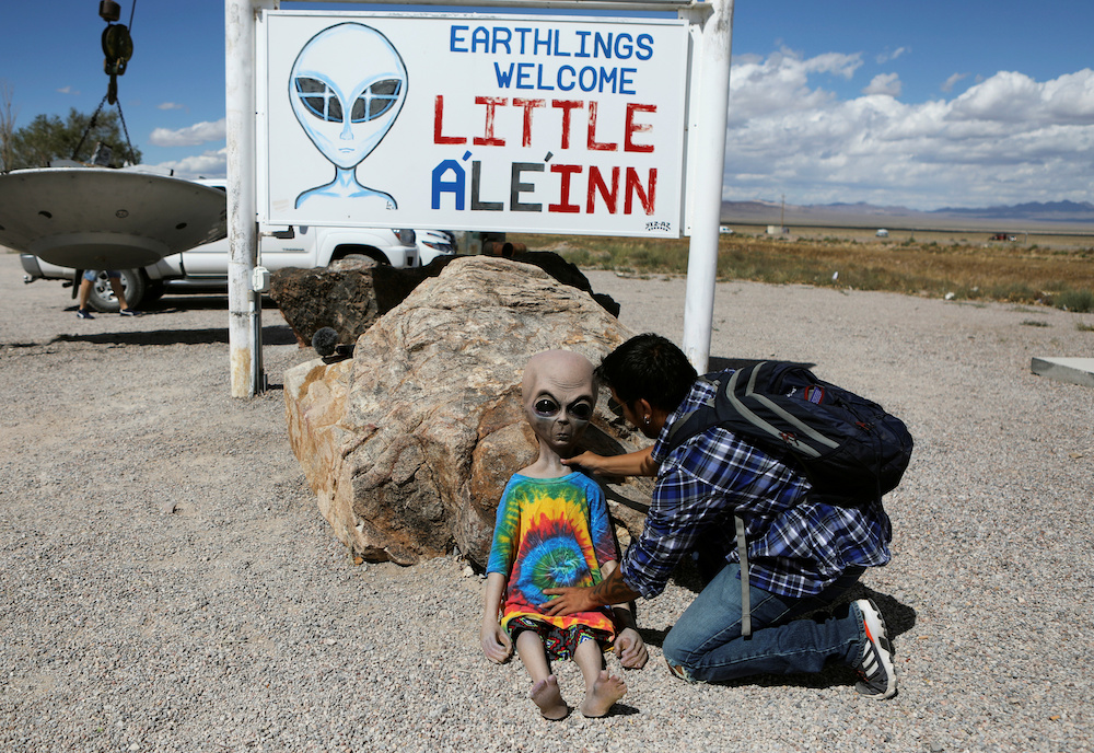 An attendee poses an alien doll at the Little A'Le'Inn as an influx of tourists responding to a call to 'storm' Area 51 in Rachel, Nevada September 19, 2019. u00e2u20acu201d Reuters pic