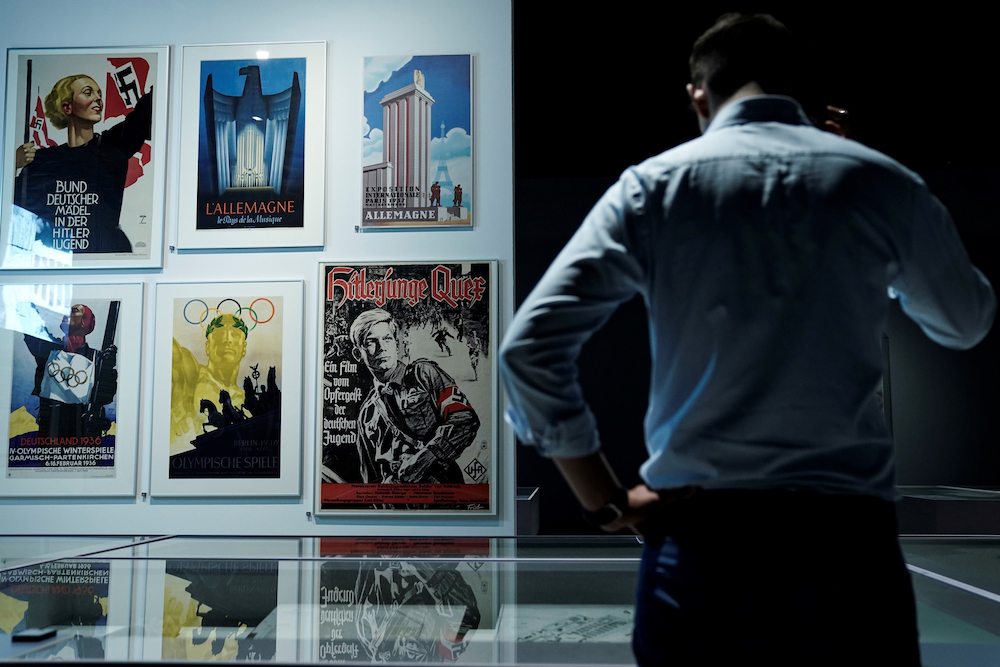 A man looks at posters displayed as part of the exhibition u00e2u20acu02dcDesign of the Third Reichu00e2u20acu2122 at the Design Museum Den Bosch in 's-Hertogenbosch. u00e2u20acu201d AFP pic