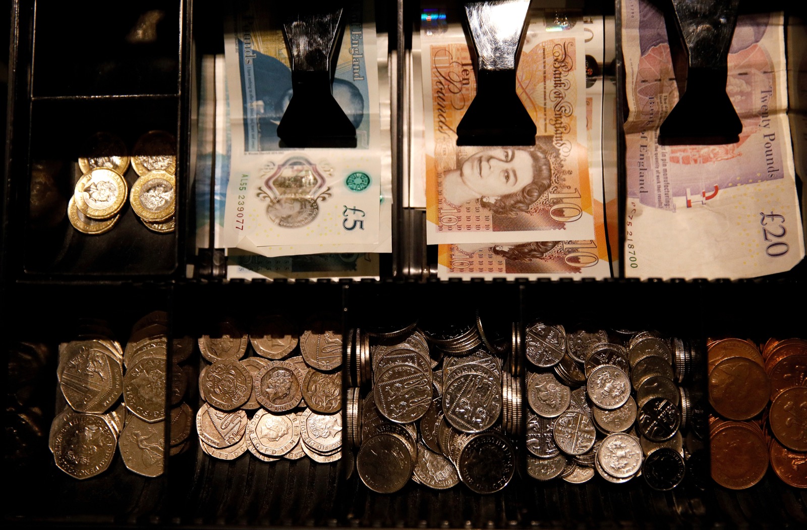 Pound Sterling notes and change are seen inside a cash register in a coffee shop in Manchester September 21, 2018. u00e2u20acu201d Reuters pic