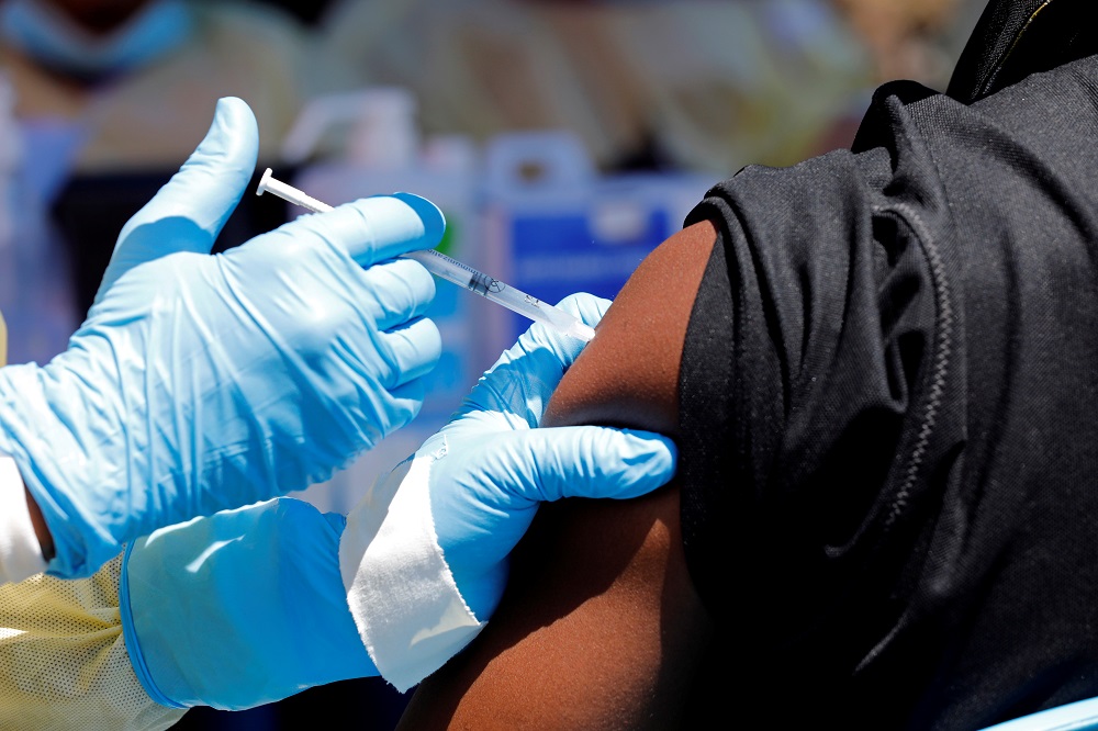  nA health worker injects a man with Ebola vaccine in Goma, Democratic Republic of Congo August 5, 2019. u00e2u20acu201d Reuters picn