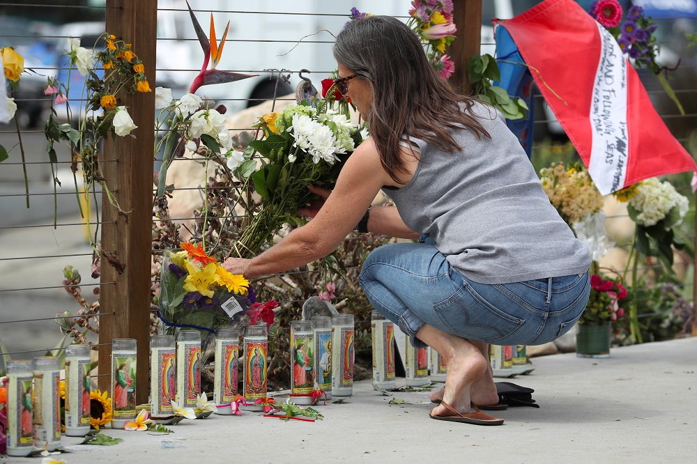 A woman places flowers at a makeshift memorial near Truth Aquatics after a pre-dawn fire sank a commercial diving boat near Santa Barbara, California September 3, 2019. u00e2u20acu201d Reuters pic