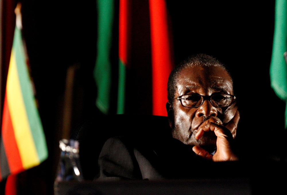 Zimbabwean President Robert Mugabe watches a video presentation during the summit of the Southern African Development Community in Johannesburg August 17, 2008. u00e2u20acu201d Reuters pic