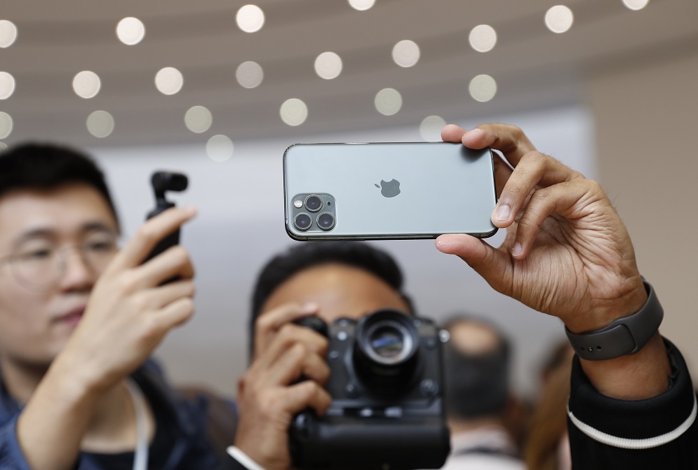 People take photos of the new iPhone 11 Pro in the demonstration room at an Apple event at their headquarters in Cupertino September 10, 2019. u00e2u20acu201d Reuters pic