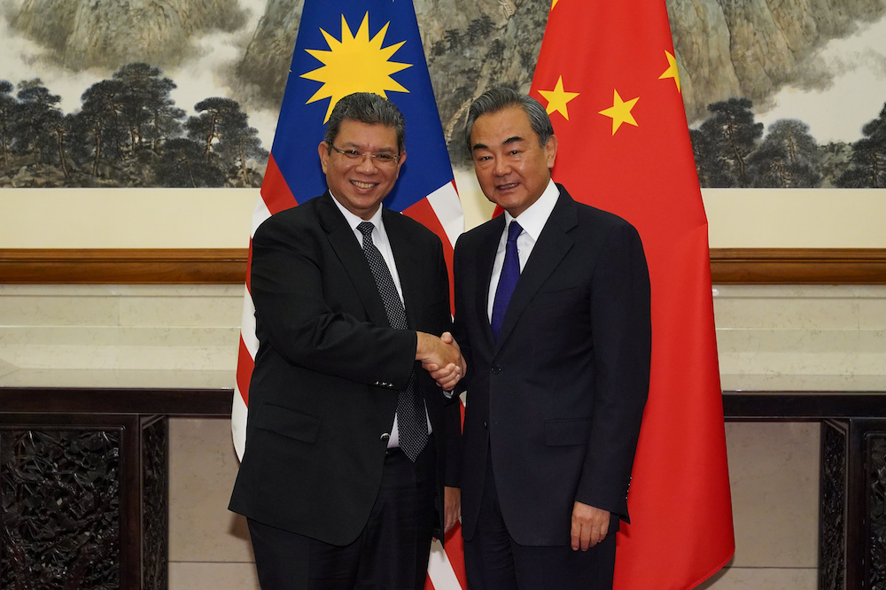 Chinese Foreign Minister Wang Yi shakes hands with Malaysian Foreign Minister Datuk Saifuddin Abdullah during a meeting at the Diaoyutai State Guesthouse, Beijing September 12, 2019. u00e2u20acu201d Reuters pic