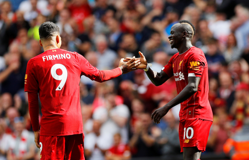 Liverpoolu00e2u20acu2122s Sadio Mane celebrates scoring their second goal with teammate Roberto Firmino during their Premier League match with Newcastle United at Anfield in Liverpool September 14, 2019. u00e2u20acu201d Reuters pic