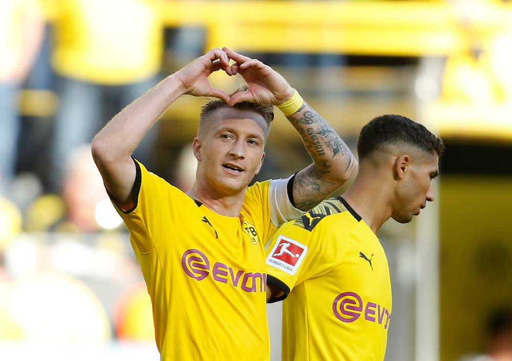 Borussia Dortmundu00e2u20acu2122s Marco Reus celebrates scoring their fourth goal during their Bundesliga match with Bayer Leverkusen at Signal Iduna Park in Dortmund September 14, 2019. u00e2u20acu201d Reuters pic