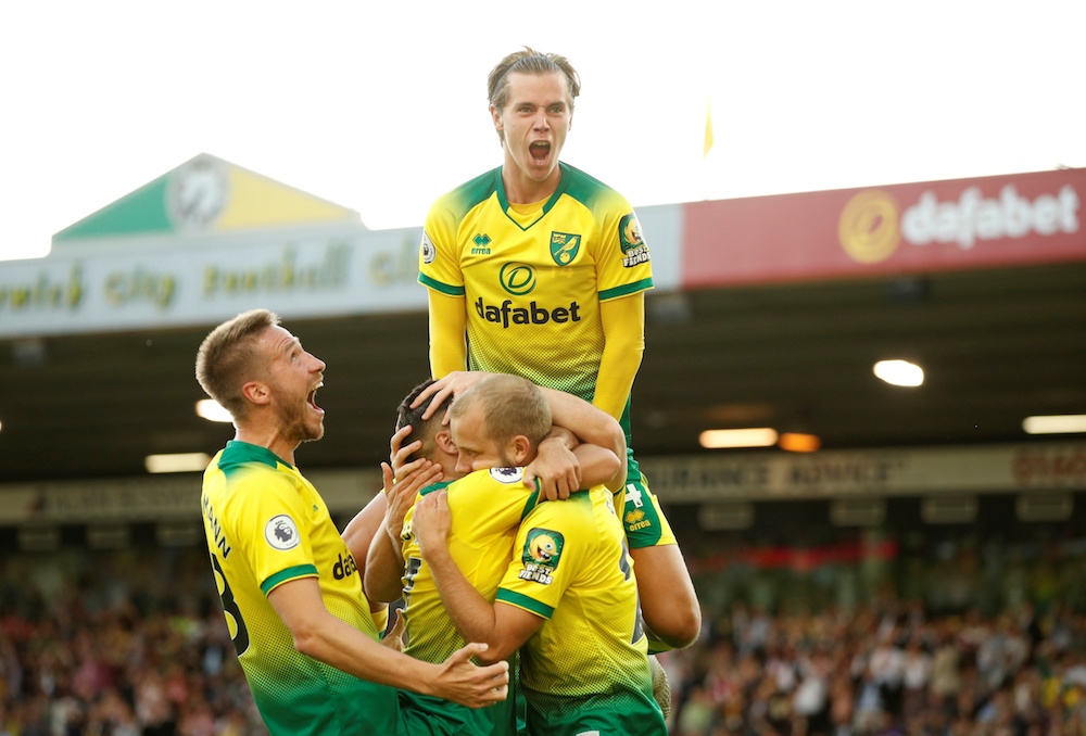 Norwich Cityu00e2u20acu2122s Teemu Pukki and Todd Cantwell celebrate with teammates after scoring their third goal during their Premier League match with Manchester City at Carrow Road in Norwich September 14, 2019. u00e2u20acu201d Action Images pic via Reuters