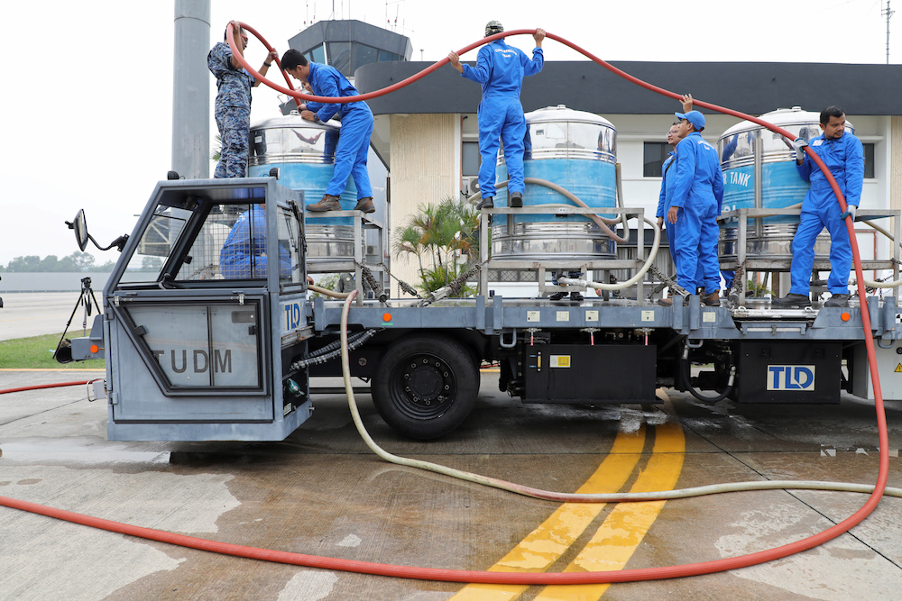 Members of the Malaysian Air Force prepare to carry out a cloud seeding operation at a military airbase in Subang September 19, 2019. u00e2u20acu201d Reuters pic