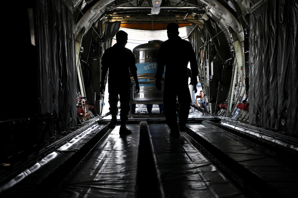 Saltwater tanks are loaded into a military plane during a cloud seeding operation at a military airbase in Subang September 19, 2019. u00e2u20acu201d Reuters pic
