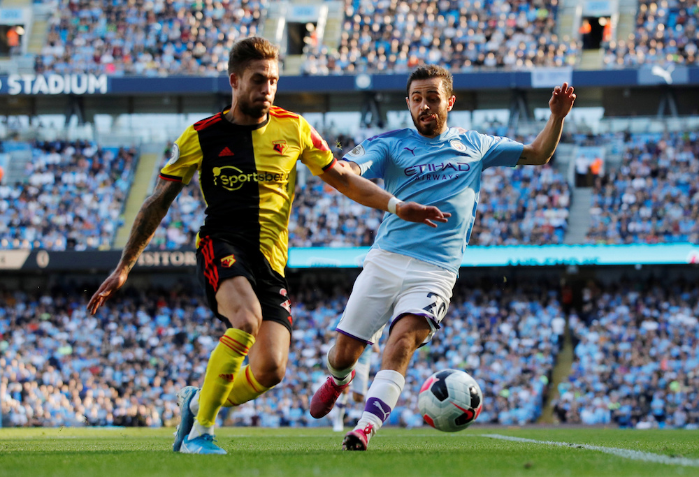 Watfordu00e2u20acu2122s Kiko Femenia in action with Manchester Cityu00e2u20acu2122s Bernardo Silva during their Premier League match at Etihad Stadium in Manchester September 21, 2019. u00e2u20acu201d Reuters pic