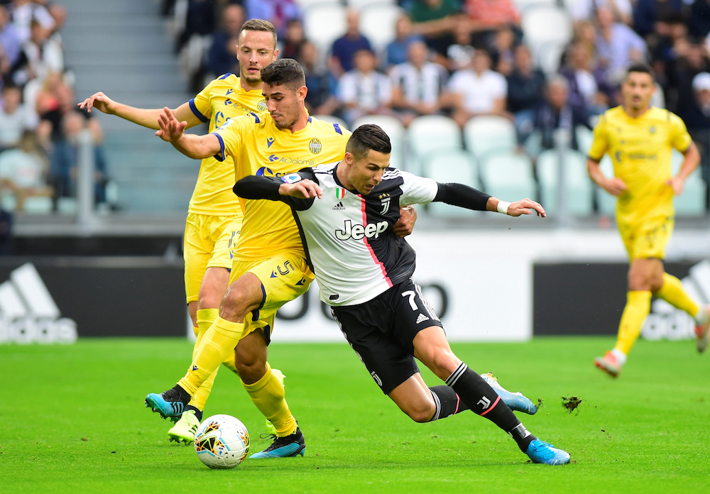 Juventusu00e2u20acu2122 Cristiano Ronaldo in action with Hellas Veronau00e2u20acu2122s Davide Faraoni during their Serie A match at Allianz Stadium in Turin September 21, 2019. u00e2u20acu201d Reuters pic