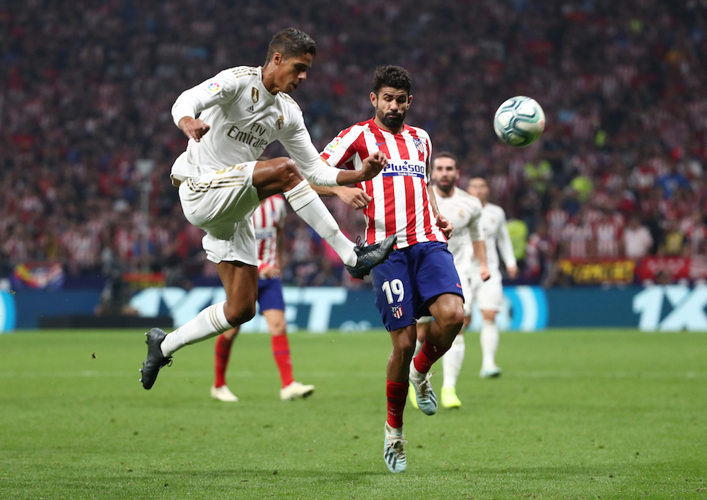 Real Madridu00e2u20acu2122s Raphael Varane in action with Atletico Madridu00e2u20acu2122s Diego Costa Soccer during their La Liga match at Wanda Metropolitano in Madrid September 28, 2019. u00e2u20acu201d Reuters pic
