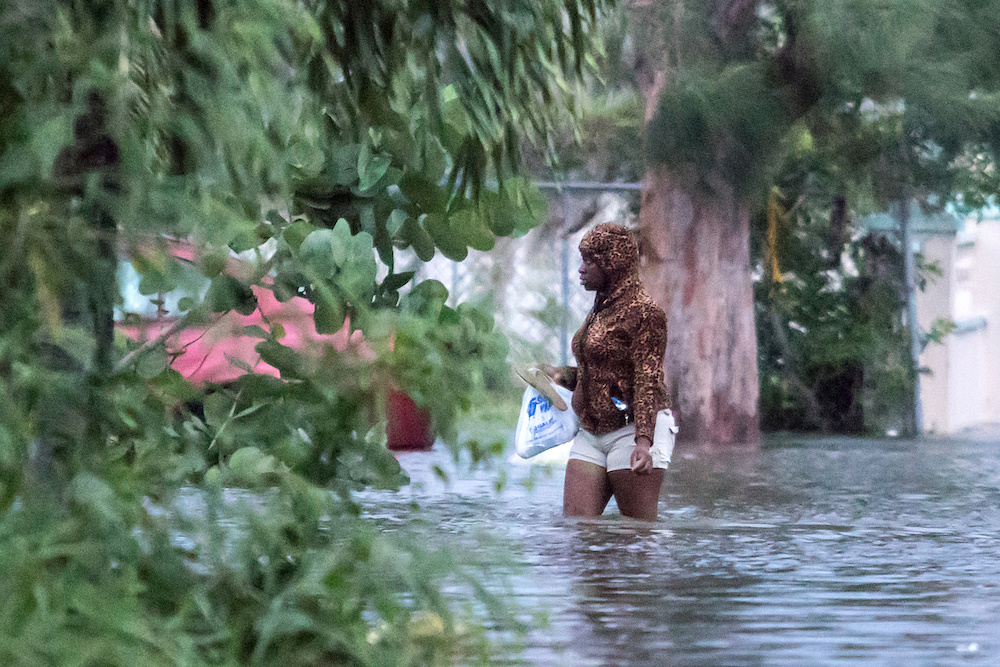 A woman walks in a flooded street after the effects of Hurricane Dorian arrived in Nassau September 2, 2019. u00e2u20acu201d Reuters pic