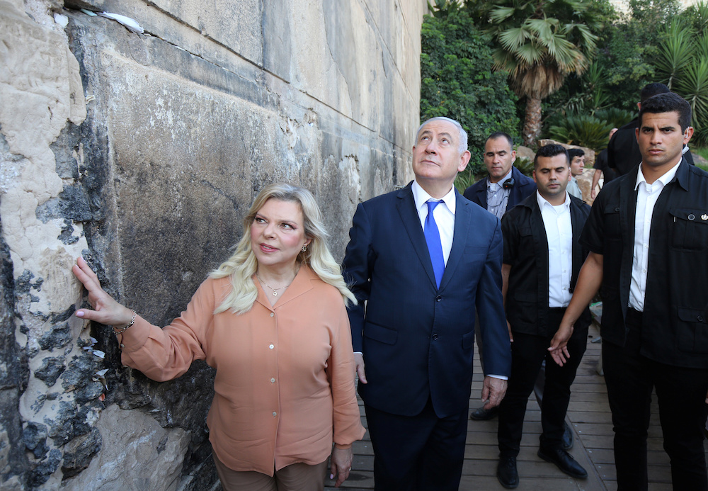 Israeli Prime Minister Benjamin Netanyahu looks up while his wife Sara touches the outside wall of the Cave of the Patriarchs in Hebron in the Israeli-occupied West Bank September 4, 2019. u00e2u20acu201d Reuters picnn