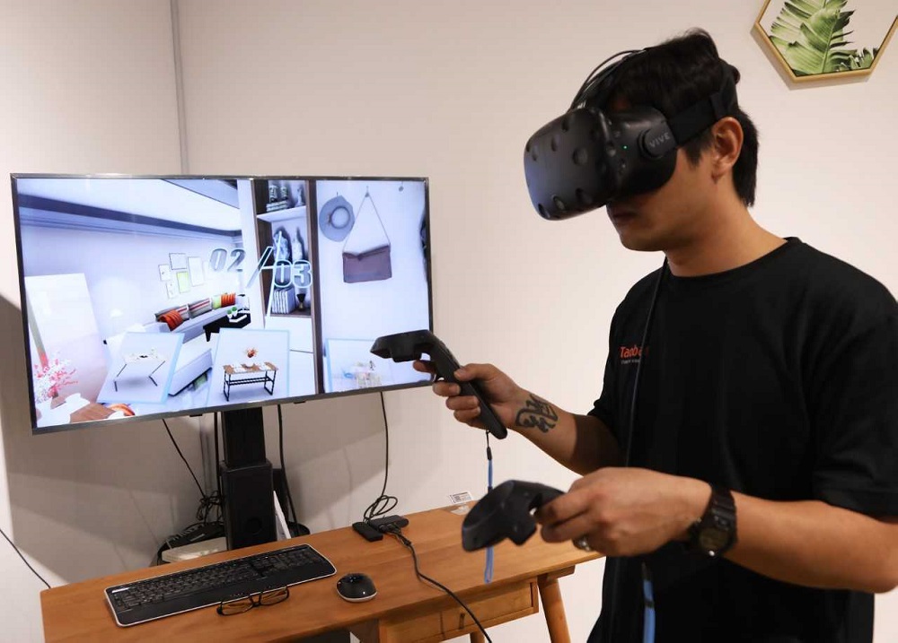Customers can use virtual reality equipment at the Taobao store to get a better sense of how various products would look in their home.—TODAY pic