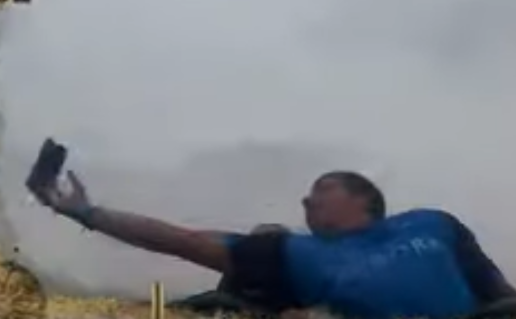 Screen capture of the video showing the incredible moment when Kempf managed to catch the phone mid-air while on the roller coaster ride. u00e2u20acu201d Picture via YouTube/sirsammy 15