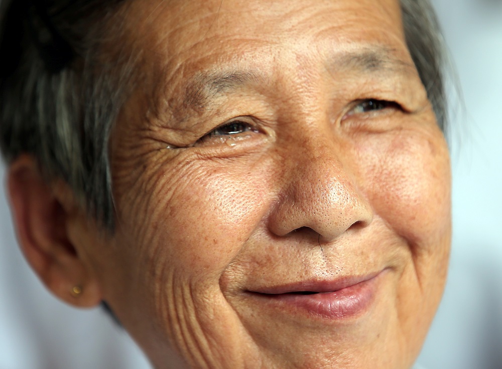 All smiles, an excited Lai Yee is excited to move into their new home.