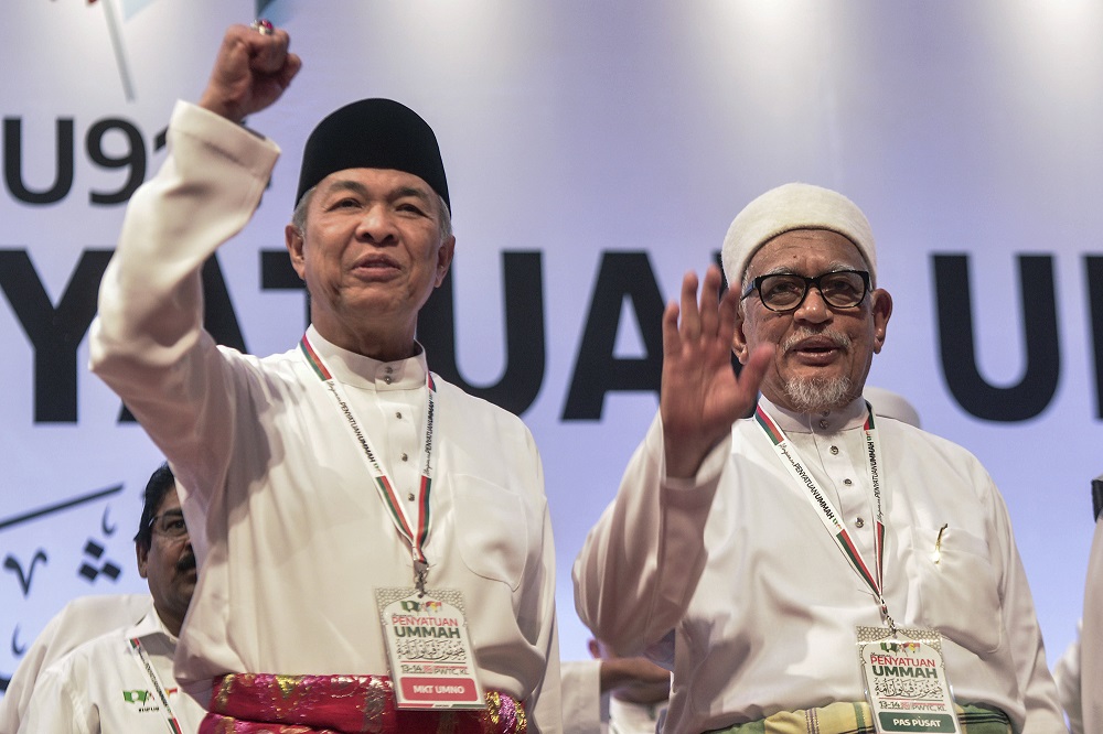 Umno president Datuk Seri Zahid Hamidi and PAS president Datuk Seri Hadi Awang at the Himpunan Penyatuan Ummah (Muslim Unity Rally) held at the Putra World Trade Centre in Kuala Lumpur September 14, 2019. — Picture by Shafwan Zaidon