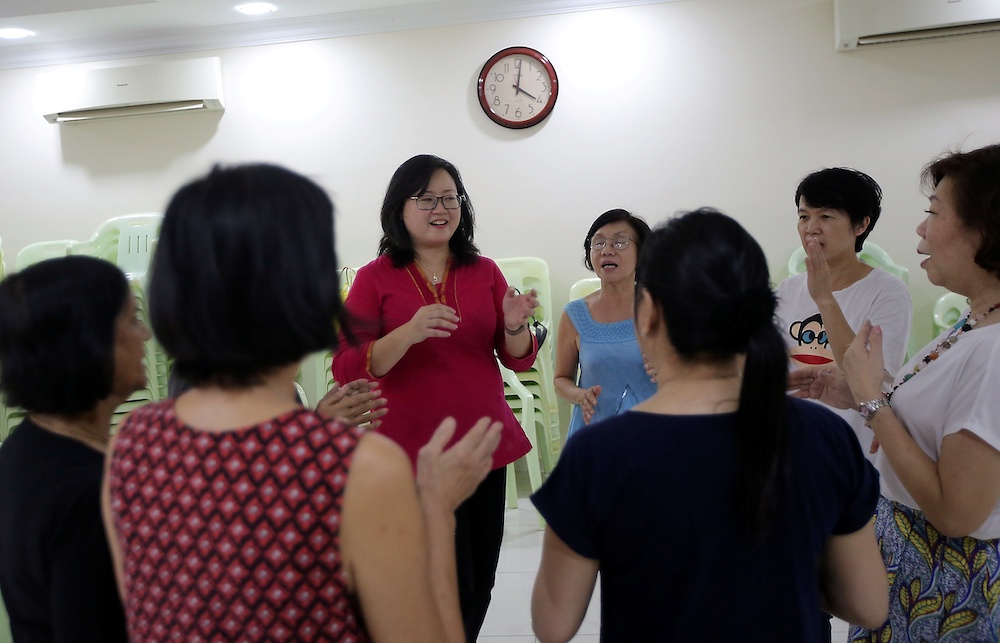 The group of 10 Perak Women for Women members undergoing warming up exercise before their choir training. u00e2u20acu201du00c2u00a0Picture by Farhan Najib 