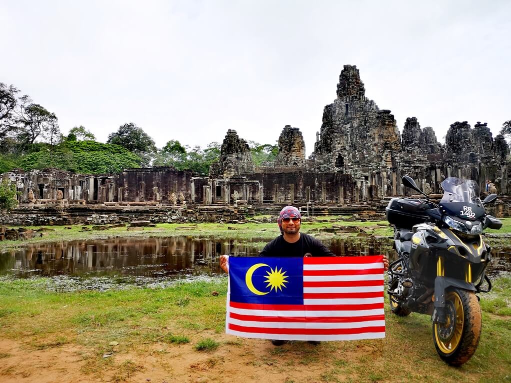 Harprit Singh aka Rider Chris poses at Bayon Temple in Angkor, Cambodia with the Jalur Gemilang. u00e2u20acu201c Pictures courtesy of Rider Chris