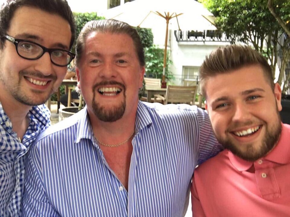 Thurlow (left), taking a photo with some of his business partners. u00e2u20acu201d Picture via Twitter/@thurlow.