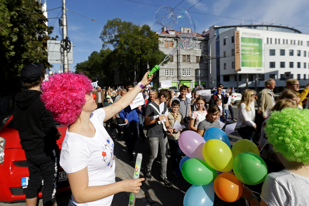 A woman makes bubbles as demonstrators march during an anti-abortion protest rally demanding a ban on abortions in Bratislava, Slovakia, September 22, 2019. u00e2u20acu201d Reuters pic
