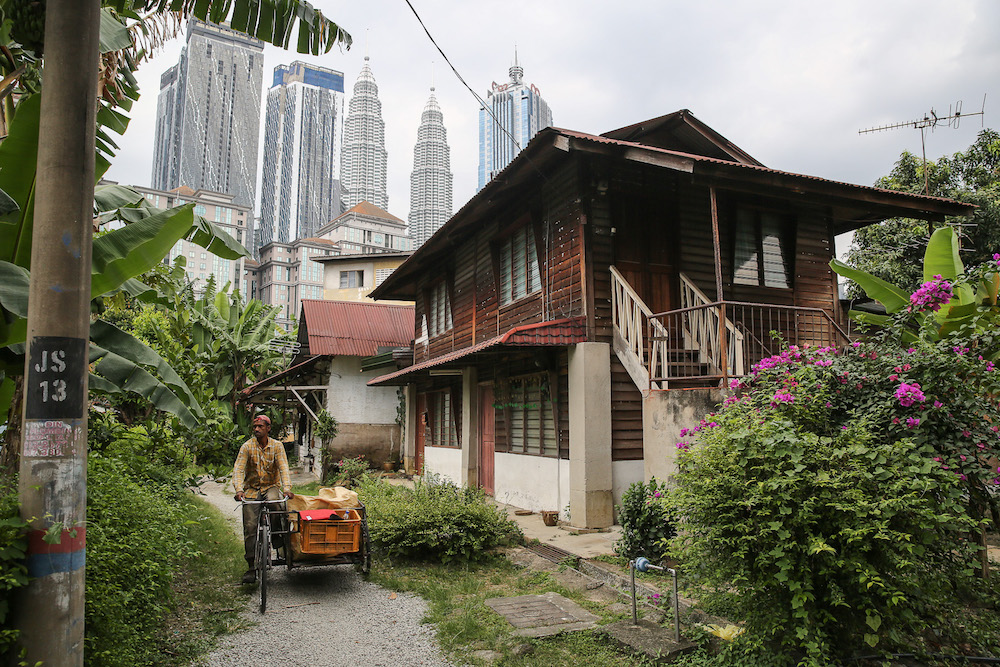 Bucolic scenes like this one are still commonplace in Kampung Baru. u00e2u20acu201d Picture by Yusof Mat Isa