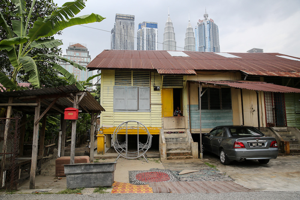 To convince residents to sell their land, public officials often point to the kampung’s somewhat shabby image, awkwardly placed amid a bustling and rapidly developing modern city. — Picture by Yusof Mat Isa