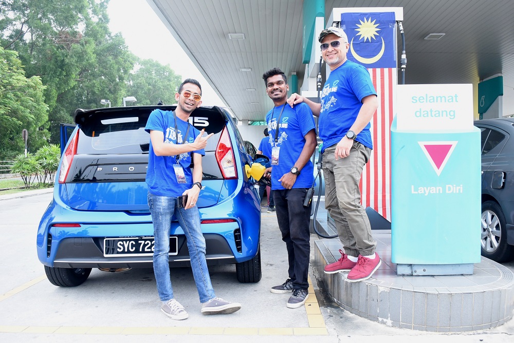 Participants getting their vehicle’s fuel tank filled up and sealed by the Proton representatives before their expedition. — Picture courtesy of Proton Holdings Berhad