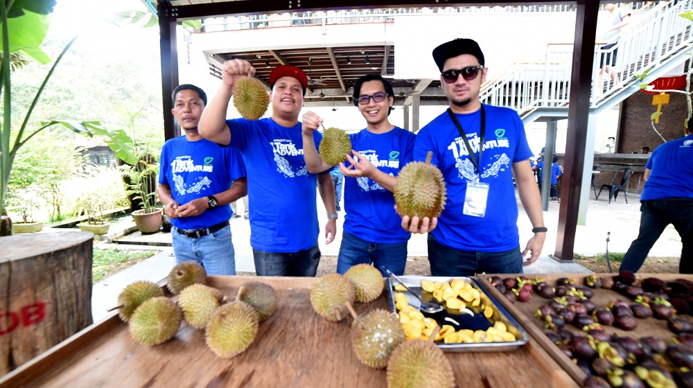 Along the way, the contestants were treated to a feast of local fruits, including durian. — Picture courtesy of Proton Holdings Berhad