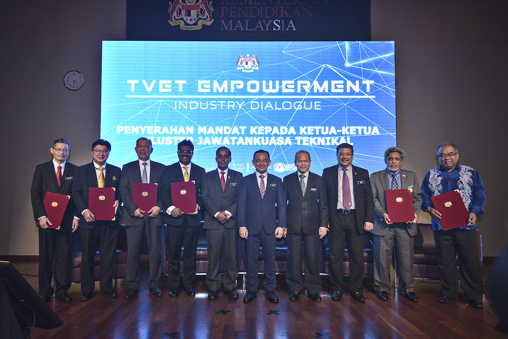 Human Resources Minister M. Kulasegaran and Education Minister Maszlee Malik takes a group photo with the TVET Empowerment Cabinet Committee in Putrajaya September 26, 2019. u00e2u20acu201d Picture by Shafwan Zaidon
