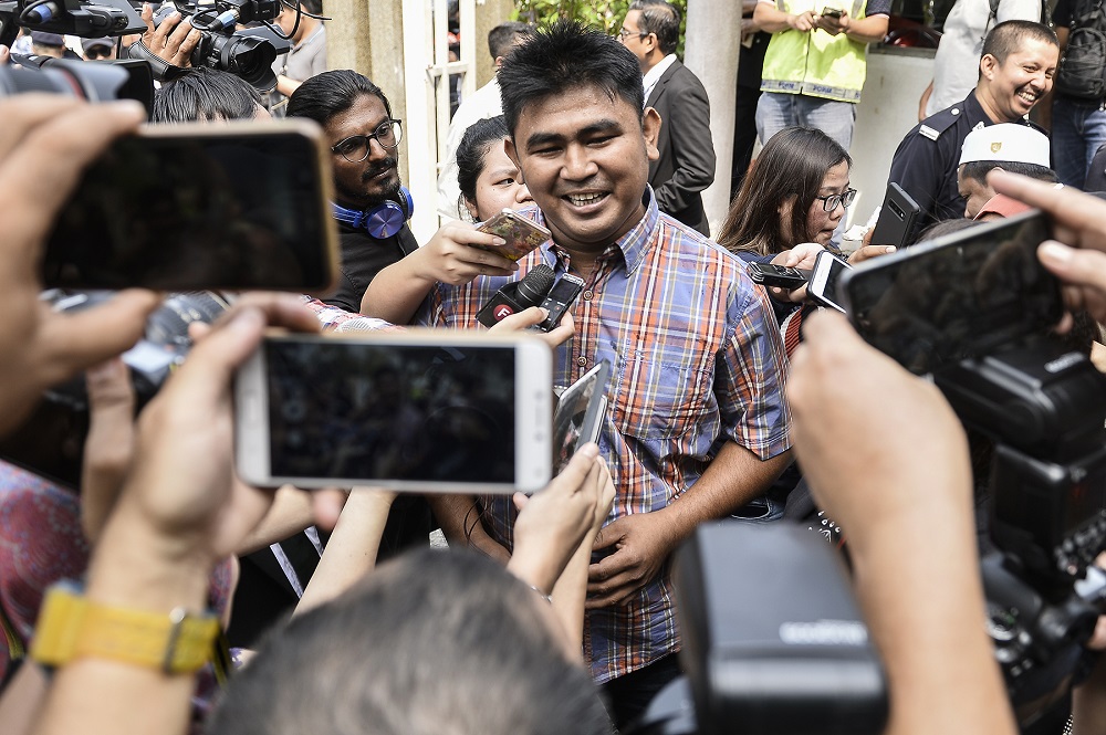 Firefighter Muhammad Adib Mohd Kassimu00e2u20acu2122s brother, Mohd Asraf Mohd Kassim, speaks during a press conference outside the Shah Alam court complex September 27, 2019. u00e2u20acu201d Picture by Miera Zulyana