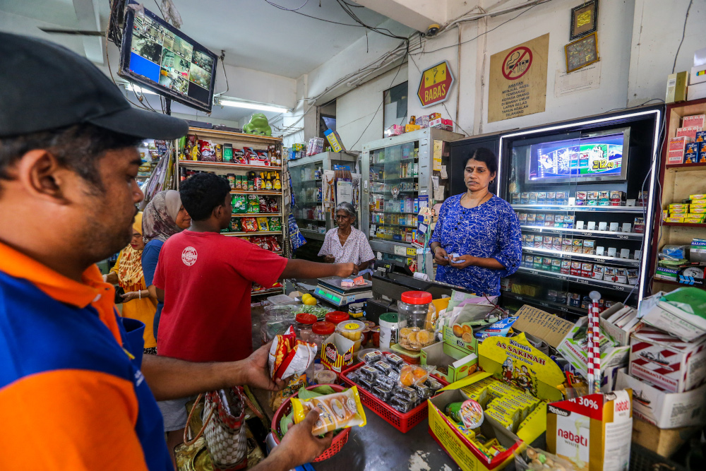 Commonplace sundry shops like this one in Desa Mentari People's Housing Projects (PPR) in Petaling Jaya provide essential goods to those living in PPRs at an affordable price. — Picture by Firdaus Latif