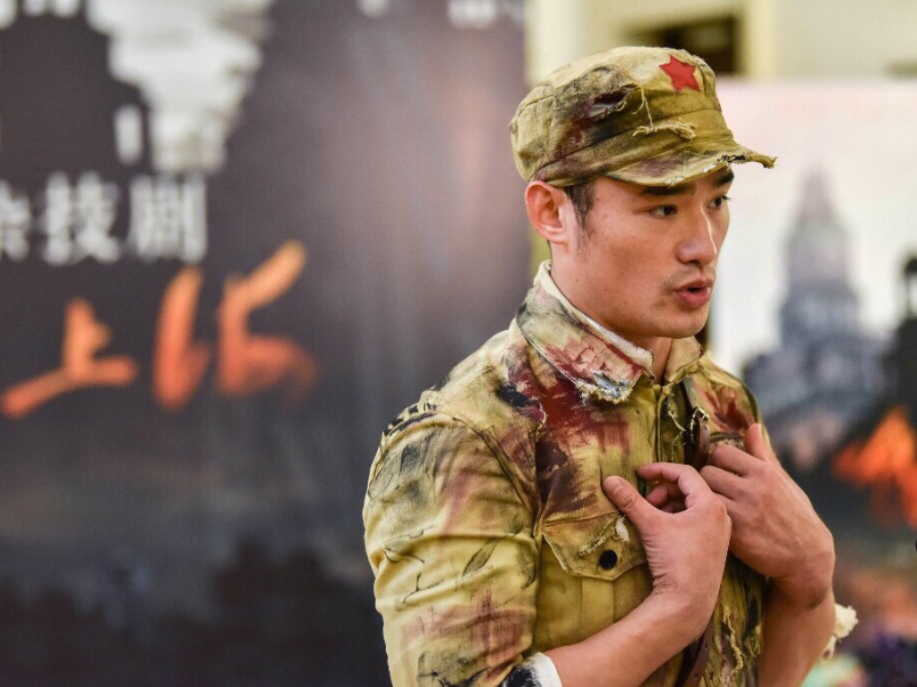 This photo taken on September 6, 2019 shows Wang Huaifu, a performer of the acrobatics show, Battle of Shanghai, speaking during an interview in Shanghai. u00e2u20acu201d AFP pic