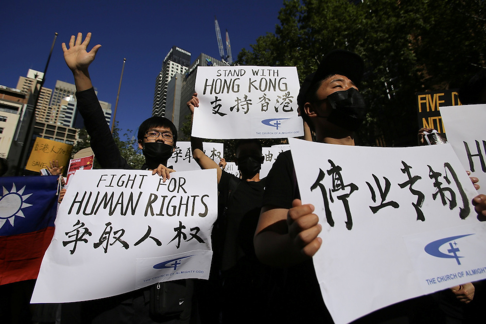 Pro-democracy supporters are seen during a Hong Kong pro-democracy demonstration in Sydney September 29, 2019. u00e2u20acu201d AAP Image/Steven Saphore handout via Reuters