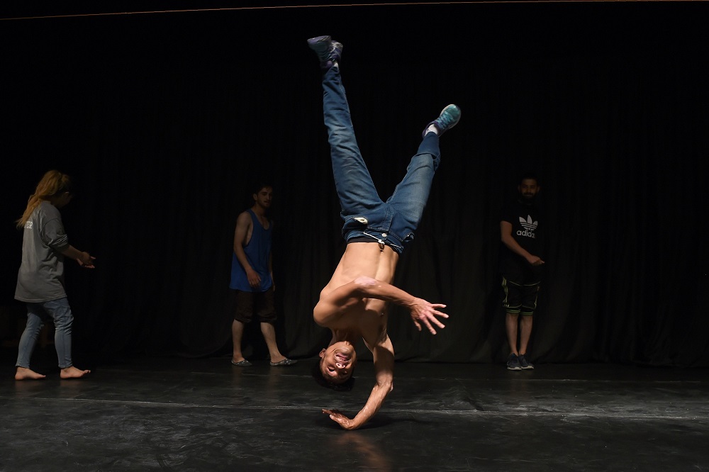 In this photo taken on August 4, 2019, an Afghan breakdancer strikes a pose during a practice session at the French Cultural Centre in Kabul. — AFP pic