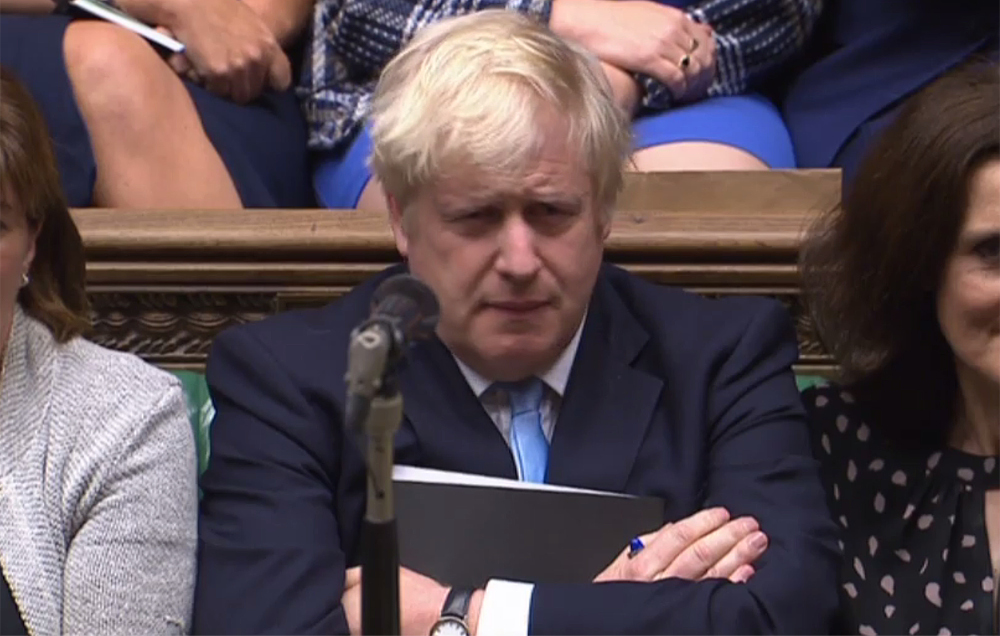 Britainu00e2u20acu2122s Prime Minister Boris Johnson reacting as the main opposition Labour Party Jeremy Corbyn speaks in response to his speech to introduce a motion for an early parliamentary general election in the House of Commons in London September 9, 2019. u00e2u20acu201d