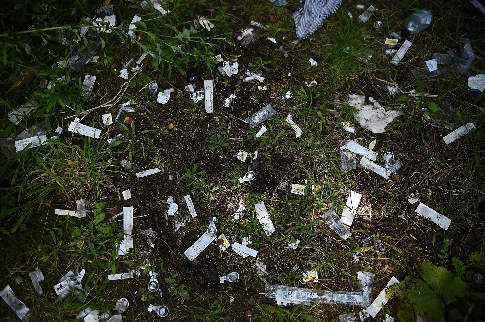 A picture shows discarded drug paraphernalia in a small wooded area used by addicts to take drugs near Glasgow city centre, Scotland August 15 2019.  u00e2u20acu201d AFP pic        