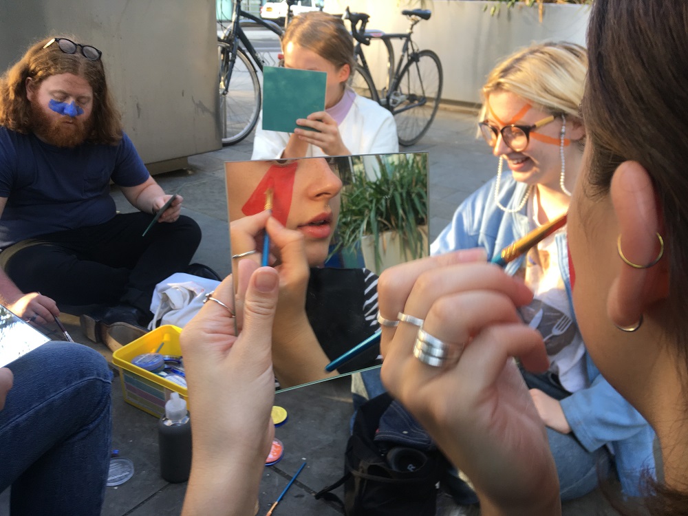 A group of people take part in a u00e2u20acu02dcdazzle clubu00e2u20acu2122 silent walk in the King's Cross area of London, applying colourful face make-up to avoid facial recognition by CCTV cameras. u00e2u20acu201d The Dazzle Club/Thomson Reuters Foundation