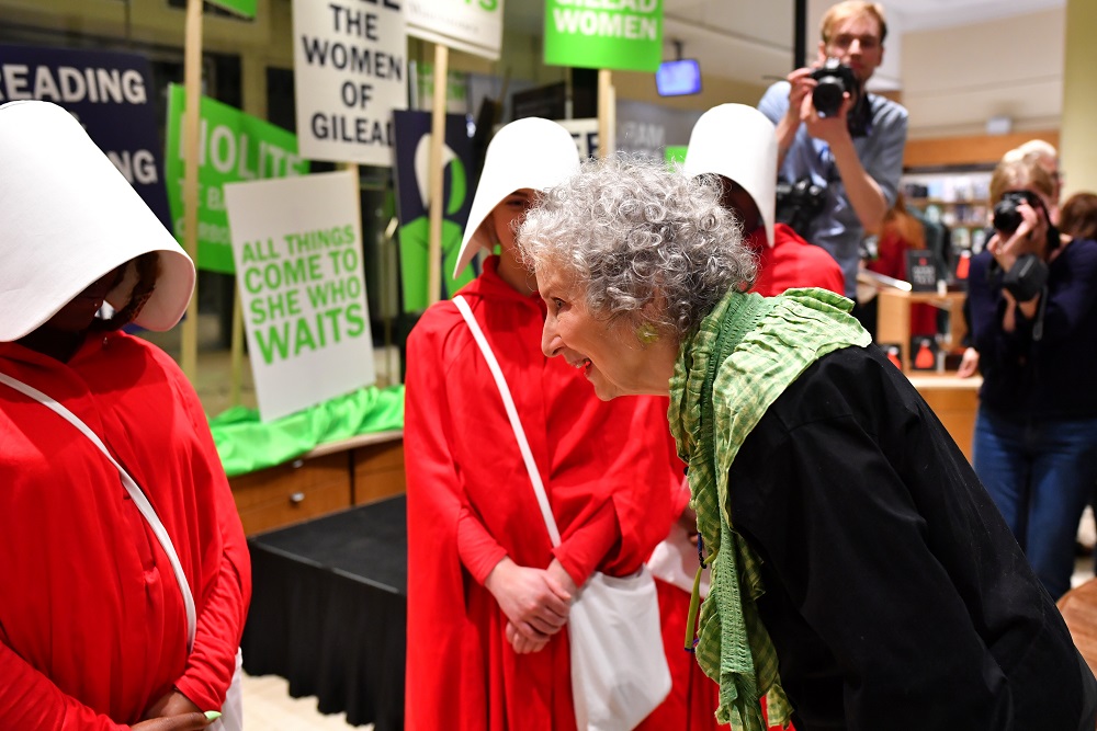 Author Margaret Atwood speaks with people dressed as hand maidens from u00e2u20acu02dcThe Handmaidu00e2u20acu2122s Taleu00e2u20acu2122, after reading an extract from her new novel u00e2u20acu02dcThe Testamentsu00e2u20acu2122 during the book launch at a book store in London September 10, 2019. u00e2u20acu201d Reuters pic 