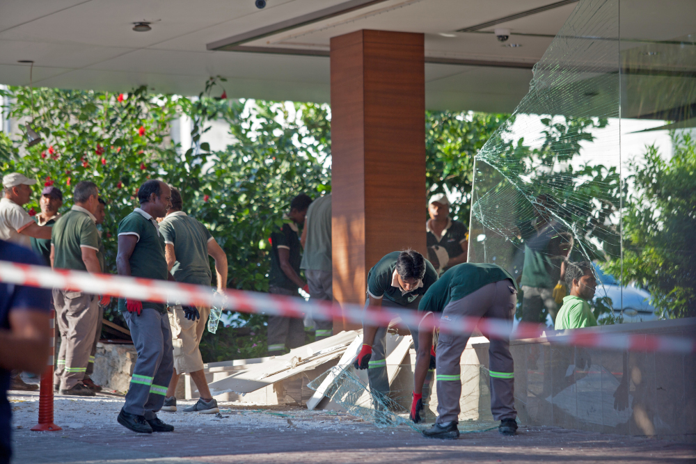 Workers at Acapulco hotel in Kyrenia in the self-proclaimed Turkish Republic of Northern Cyprus north of the divided Cypriot capital Nicosia, assess the damage after the building was damaged when a military depot exploded nearby, September 12, 2019. u00e2u20acu201d A