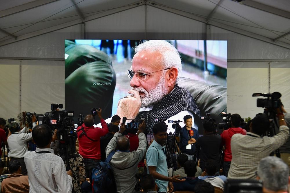 Indiau00e2u20acu2122s Prime Minister Narendra Modi is seen on a tv screen as he watches the live broadcast of the soft landing of spacecraft Vikram Lander of Chandrayaan-2 on the surface of the Moon at ISRO command centre in Bangalore, September 7, 2019. u00e2u20acu201d AFP pic