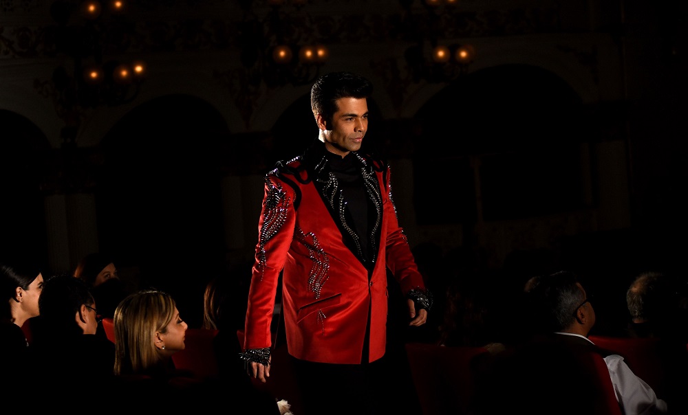 Indian Bollywood film director-producer Karan Johar showcases a creation by designer Gaurav Gupta at the opening of Lakme Fashion Week (LFW) Summer Resort 2019 in Mumbai on January 29, 2019. u00e2u20acu201d AFP pic           