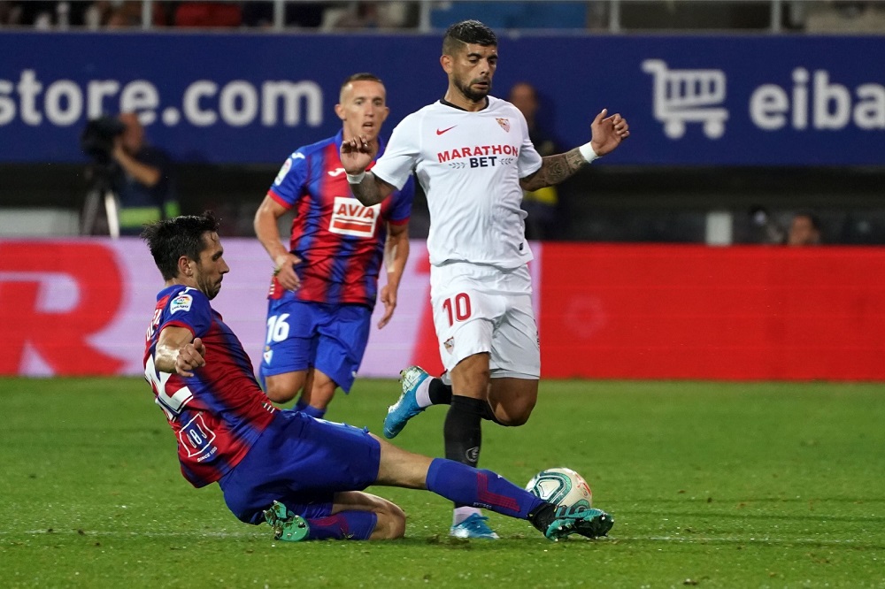 Eibar's Portuguese defender Paulo Oliveira vies with Sevilla's Argentinian midfielder Ever Banega during the match at the Ipurua stadium in Eibar September 26, 2019. u00e2u20acu201d AFP pic