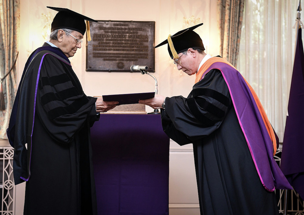 Prime Minister Tun Dr Mahathir Mohamad receives the Honorary Doctor of Humane Letters from Doshisha University President Takashi Matsuoka at Amherst House in Kyoto September 6, 2019. u00e2u20acu201d Bernama pic