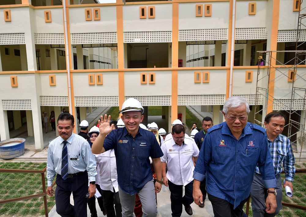 Education Minister Maszlee Malik (second left) and Sarawak Minister of Education, Science, and Technological Research Datuk Seri Michael Manyin Jawong (second right) during a visit to SMK Sg Tapang in Kuching September 17, 2019. u00e2u20acu201d Bernama pic