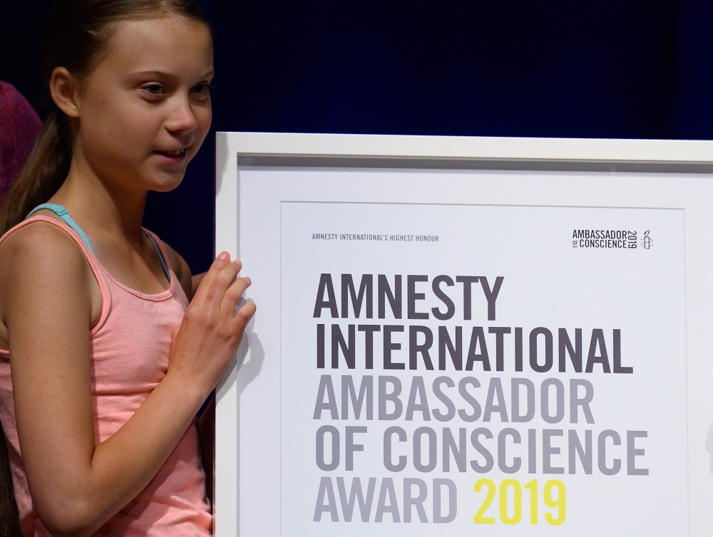 Swedish climate activist Greta Thunberg poses with her Amnesty International's Ambassador of Conscience award at George Washington University in Washington September 16, 2019. u00e2u20acu201d AFP pic          