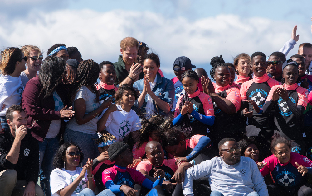 Prince Harry Duke of Sussex and Meghan Duchess of Sussex, pose with members of u00e2u20acu02dcWaves For Changeu00e2u20acu2122 NGO at Monwabisi Beach outside of Cape Town September 24, 2019. u00e2u20acu201d AFP pic